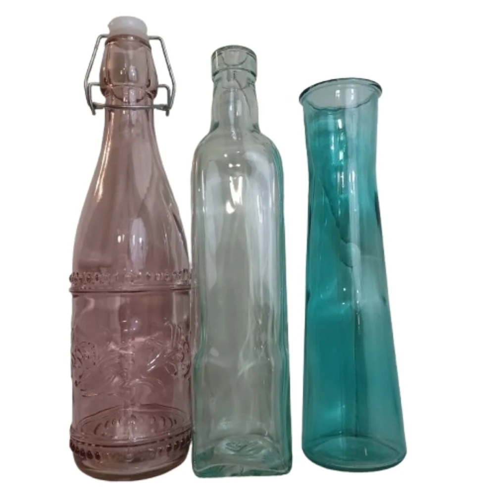 Set of Three Decorative Glass Bottles Clear Glass Light Pink And Teal Vases